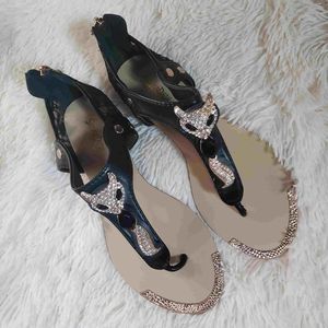 Silverdew rhinestone studded & gold toned fox gladiator style T-strap sandals